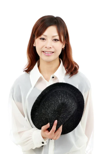 Portret van een jonge vrouw met een hoed — Stockfoto