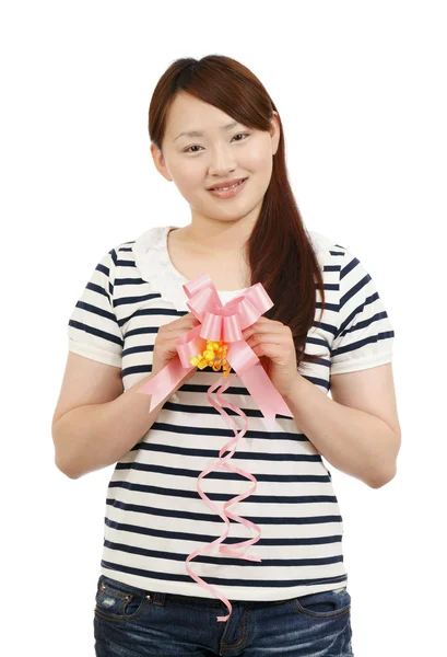 Asian young woman with a ribbon — Stock Photo, Image