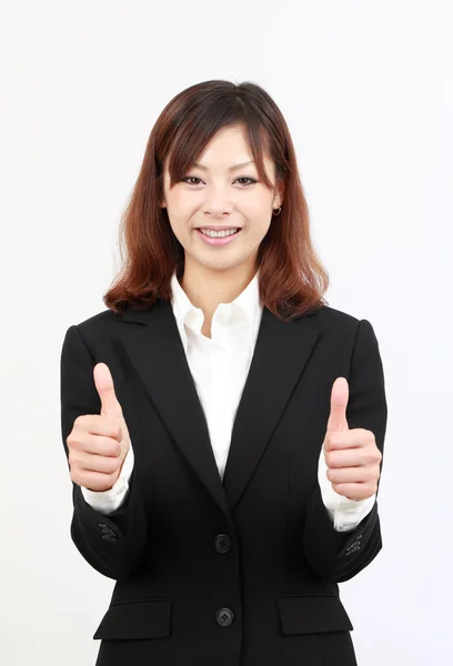 Smiling asian business woman showing thumbs up — Stock Photo, Image