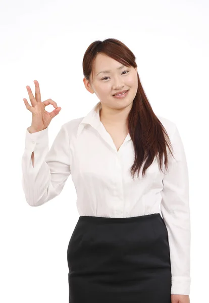 Smiling asian businesswoman with okay gesture — Stock Photo, Image