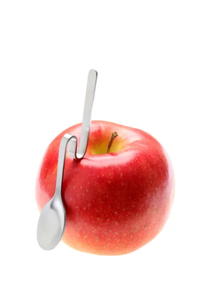 Apfel und Löffel — Stockfoto