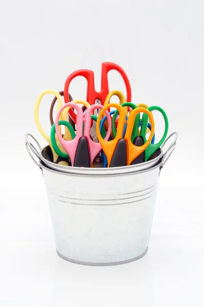 Bucket and colorful scissors — Stock Photo, Image
