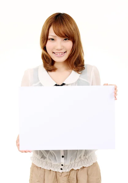 Young asian business woman holding empty board — Stock Photo, Image
