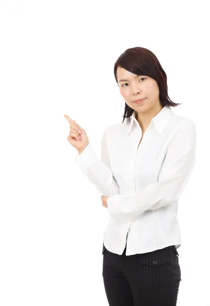 Young asian businesswoman rise hand and pointing copyspace — Stock Photo, Image