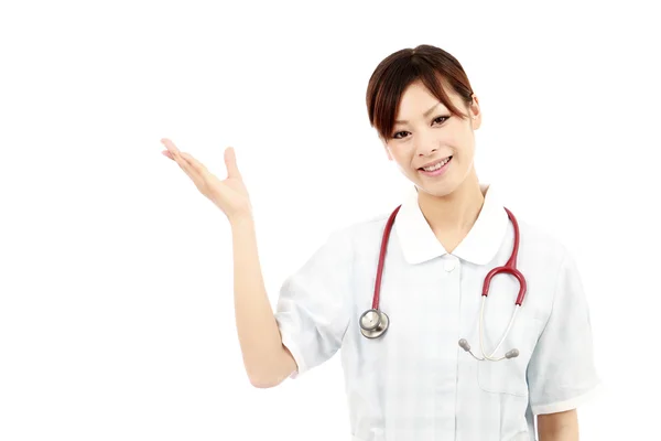 若いアジアの女性看護師の手空白記号の表示 — ストック写真