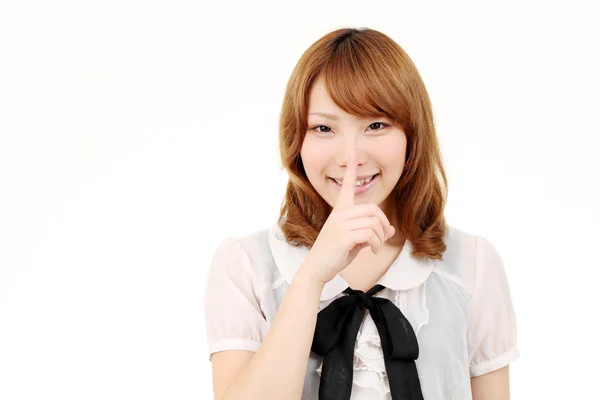Unga asiatiska affärskvinna att sätta finger på läppar — Stockfoto