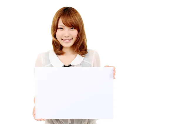 Young asian business woman holding empty white board — Stock Photo, Image