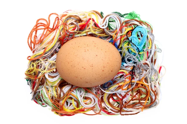 Egg and threads — Stock Photo, Image
