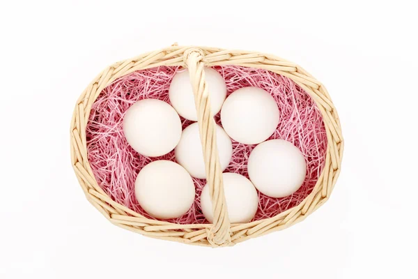 Eggs in the basket on white — Stock Photo, Image