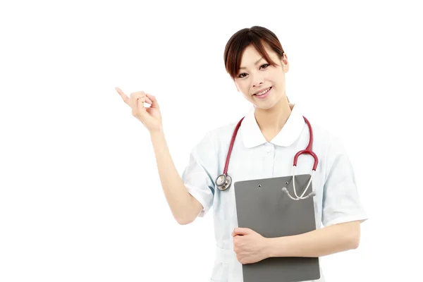 Jeune asiatique femelle infirmière pointage — Photo