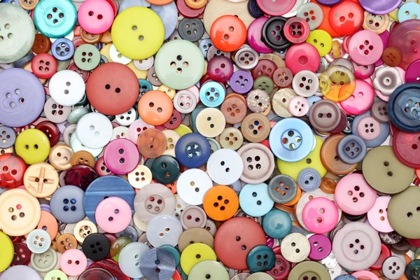 Botones surtidos como fondo colorido — Foto de Stock