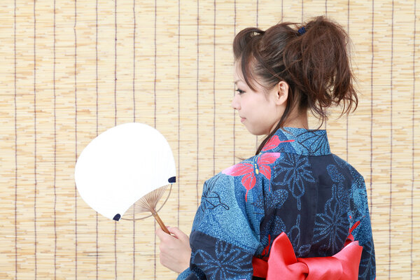 Japanese woman in traditional clothes of kimono