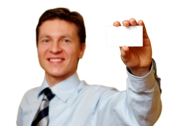 Affärsman som innehar ett vitt kort, urklippsbana ingår — Stockfoto