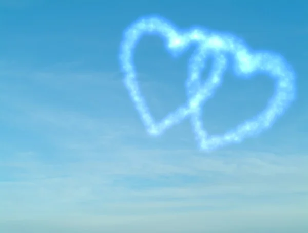 Heart shaped clouds on blue sky — Stock Photo, Image