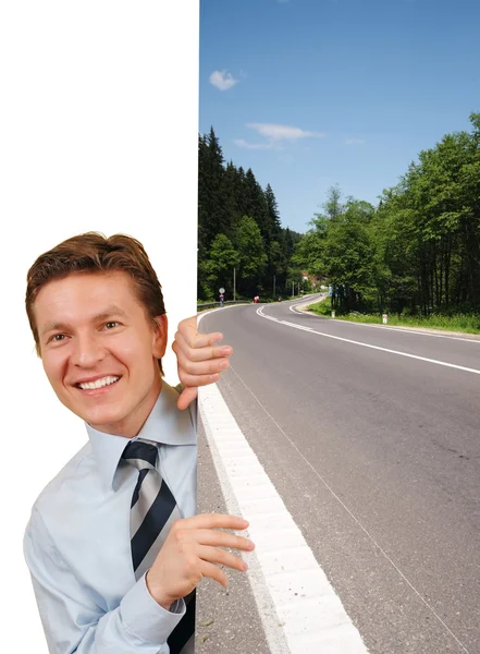 Smiling business man holding a image against white — Stock Photo, Image