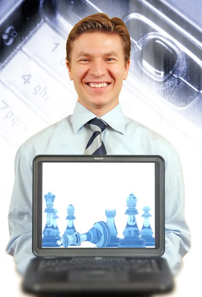 Young businessman presenting a laptop — Stock Photo, Image