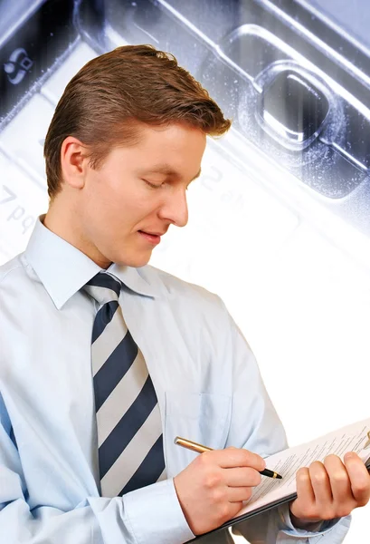 Young businessman taking notes — Stock Photo, Image