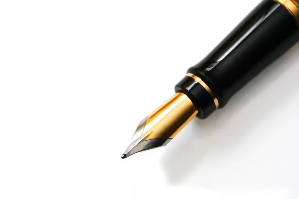 Closeup of gold-nibbed fountain pen over white. — Stock Photo, Image