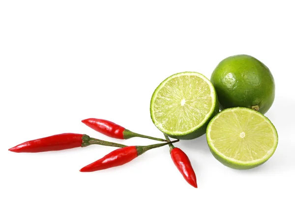 Limes and Chilli Peppers — Stock Photo, Image