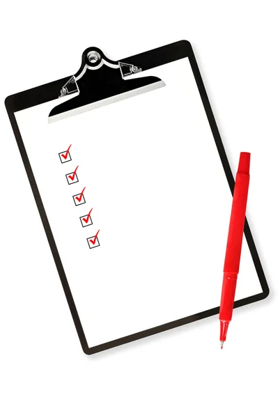 Буфер обмена с контрольным листом и красной ручкой — стоковое фото