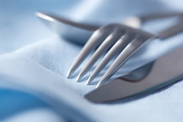 Cutlery on Blue Linen — Stock Photo, Image