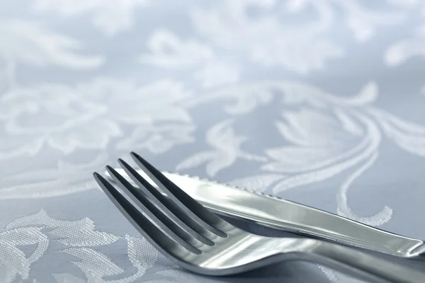 Knife and Fork on White Linen — Stock Photo, Image