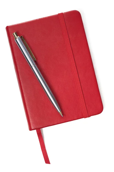 Lilla röda bok och penna — Stockfoto
