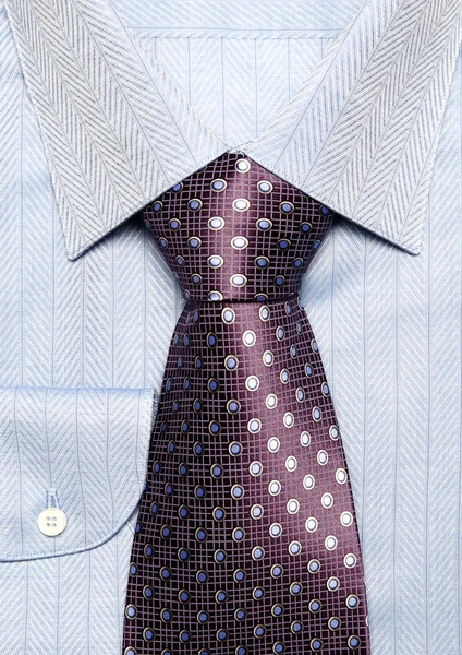 stock image Dark blue man's shirt with a violet tie