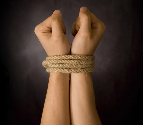 Hands with a rope — Stock Photo, Image
