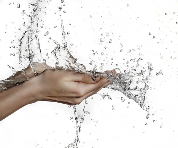 Donna mano in spruzzi d'acqua — Foto Stock