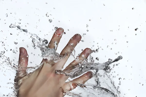 Woman hand in water splash — Stock Photo, Image