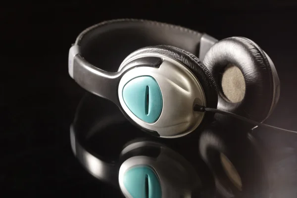 Headphones on black — Stock Photo, Image