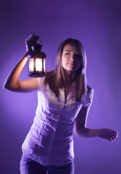 Beautiful girl with lantern seeking in night — Stock Photo, Image