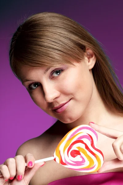 Girl with sweetmeat — Stock Photo, Image