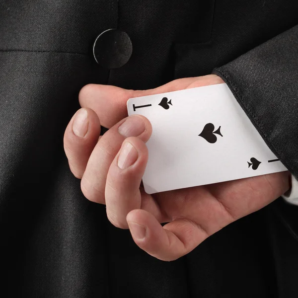 Magician hiding card — Stock Photo, Image