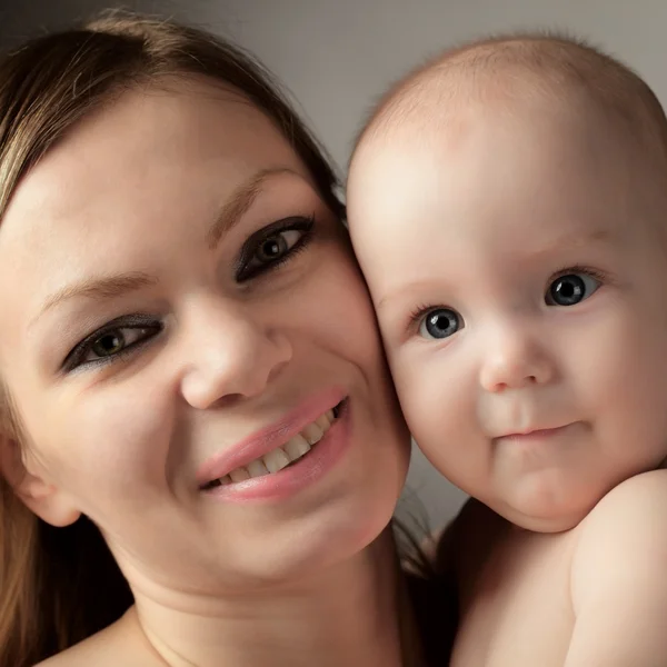 Baby og mor - Stock-foto