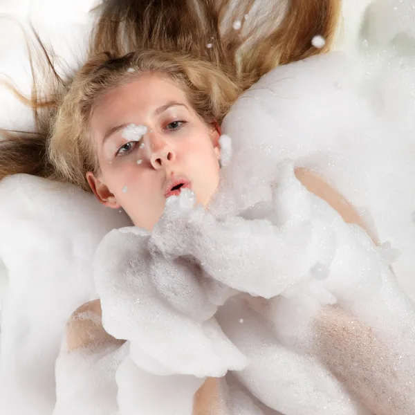 Beauty woman in foam — Stock Photo, Image