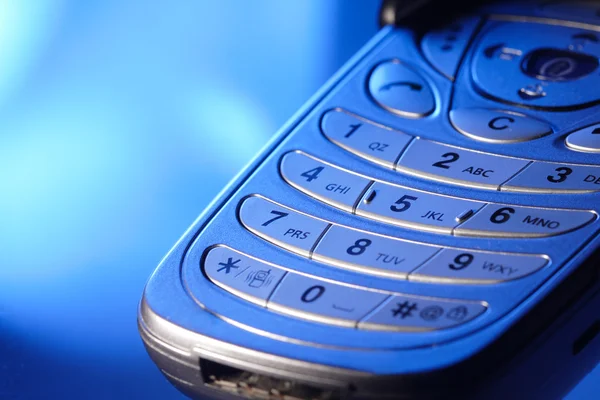 青い光の中で電話のキーパッド — ストック写真