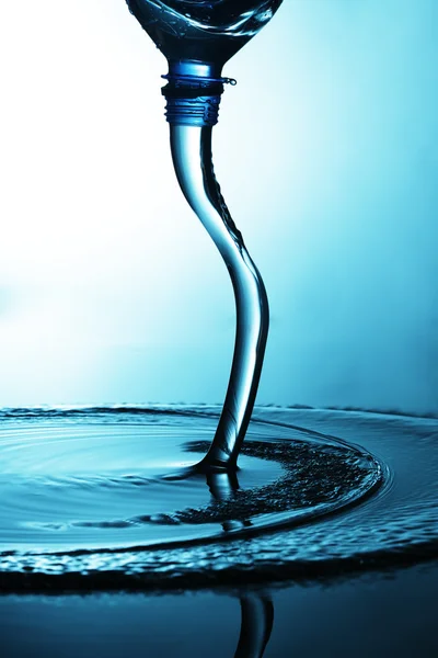 Water flows from bottle — Stock Photo, Image