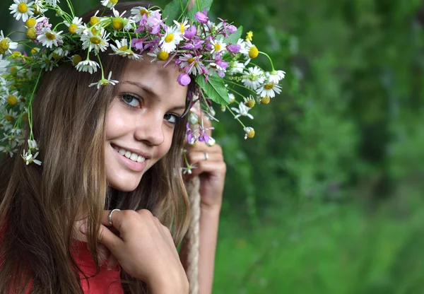 Girl in a flower wreath — Stock Photo, Image