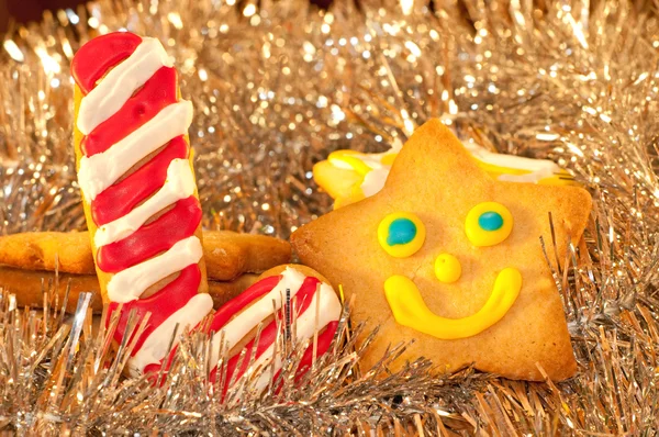 Christmas cookies shaped like candy cane and a happy star — Stock Photo, Image