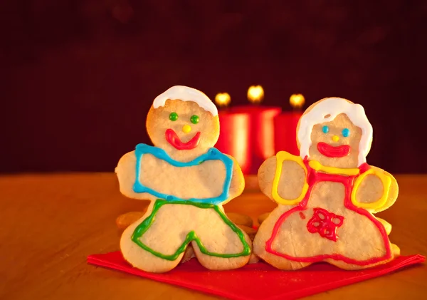 Two Christmas cookies holding hands — Stock Photo, Image