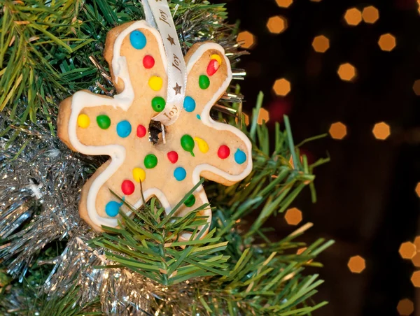 Delightfully brightly decorated snowflake shaped Christmas cookie — Stock Photo, Image