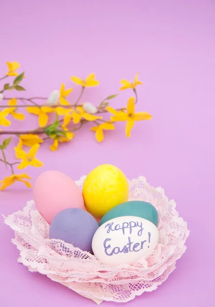 Easter eggs nested in light pink lace — Stock Photo, Image