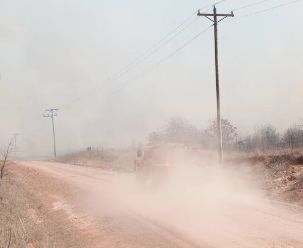 Rural area firetruck on its way to stop a wildfire