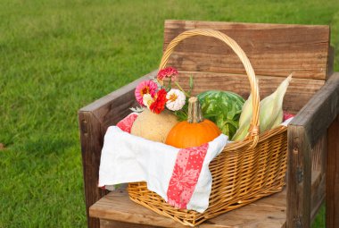 Harvest basket with produce and flowers clipart