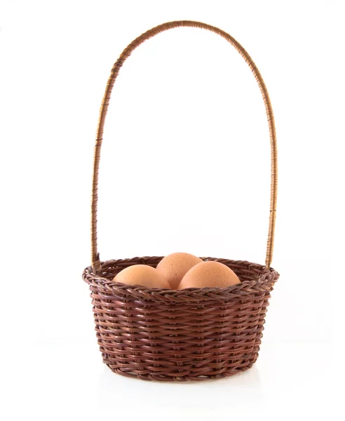 The eggs and the wicker basket — Stock Photo, Image
