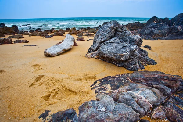 Rock and sandy beach — Stok fotoğraf