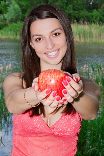 Pretty Young Woman Holding Apple