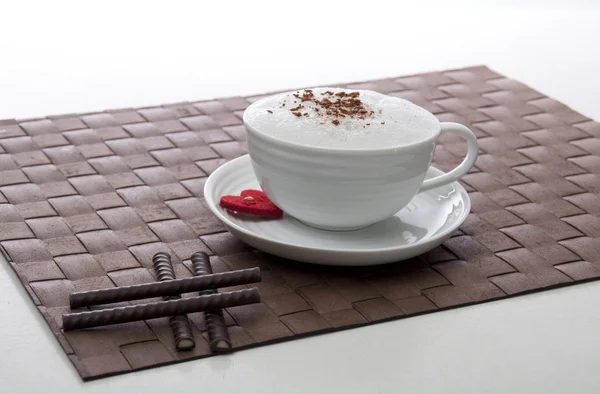 Chocolate sticks with an original white cup of coffee and lovel — Stock Photo, Image